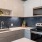 a kitchen with white cabinets