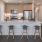 a kitchen with stools and a bar stool