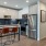 a kitchen with a table and chairs